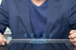 Modern E Learning Concept with a Businessman Using a Tablet Device photo