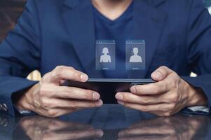 Person Using Smartphone for Call with Two Profiles on Screen photo
