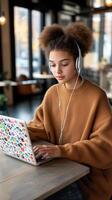 Young software developer immersed in work at a modern co-working space with natural light photo
