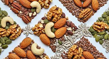 Nuts and seeds are arranged in a square pattern photo