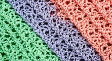 A close up of a colorful knitted scarf photo