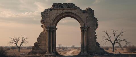 The ruins of an ancient archway in the desert photo