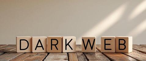 Wooden cubes spelling dark web on a rustic table photo