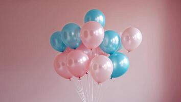 Pink and blue balloons floating on pink wall background photo