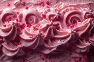 Pink frosting swirls with red sugar crystals photo