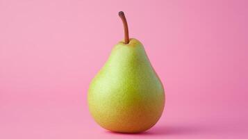 A Bright Green Pear on a Soft Pink Background Perfect for Food Related Concepts and Design Themes photo