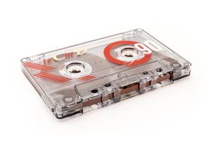 Audio cassette tape - old vintage compact audio cassette on its side isolated on white, bottom view photo