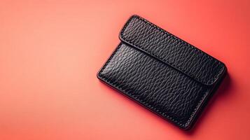 Stylish Minimalist Black Leather Wallet on a Soft Core Background Perfect for Fashion and Accessory Promotions photo