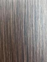 Dark wood texture with vertical grain. Excellent as background for graphic design, interior decor, or product display. photo