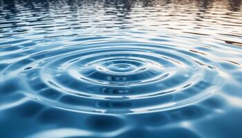 Concentric water ripples radiate outwards from a central point. Perfect for themes related to water, serenity, and cause-and-effect. photo
