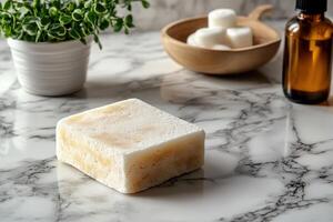 A soap bar sitting on a marble counter photo
