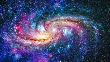Spiral galaxy with glowing center and swirling star clusters in deep space. Cosmic background video