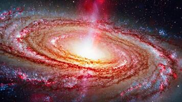 Spiral galaxy with glowing center and swirling star clusters in deep space video