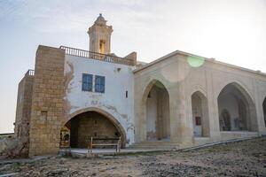 Monastery of Apostle Andrew stands near the northeasternmost cape of Northern Cyprus. The image highlights a sacred pilgrimage site and its historical and spiritual significance. High quality photo