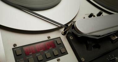 A close up of a record player with a clock on it video