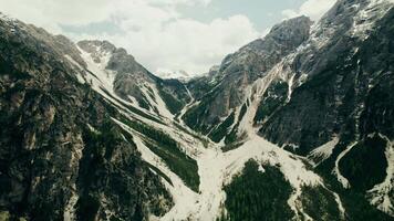 A mountain valley with snow and trees video