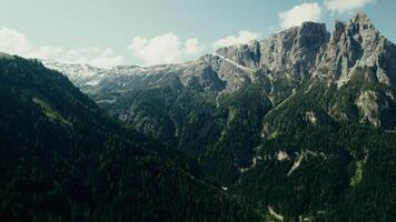 A mountain range and valley with trees and a river video