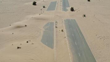 An aerial view of a desert road with sand video