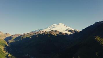 Aerial view of mountain with a snow capped peak video