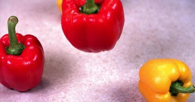 Red, yellow and green peppers on a table video