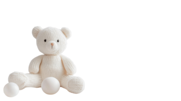 Soft white teddy bear with textured fabric and two white balls on a simple background enhancing childlike charm png