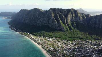 Waimanalo Beach has turquoise waters, golden sands along the coast, and green cliffs of the Honolulu Forest Reserve. video