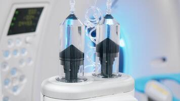 Close-up of a contrast agent before diagnostics in a CT room. The concept of using innovative technologies for accurate vascular examinations. Advertising. Medicine concept. No people video
