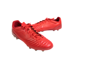 Minimalist red soccer cleats featuring smooth contours and lightweight material, ensuring speed and agility for players seeking a bold and striking sportswear option png