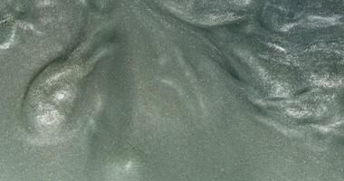 A close up of a green substance on a surface photo