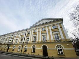 Elegant historical building with classical architecture in Warsaw, Poland under a cloudy sky photo