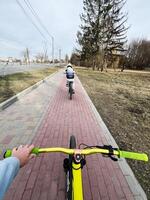 Biking on a Suburban Pathway in Early Spring During a Clear Day photo