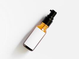 amber spray bottle lying at angle with blank white label clean white surface photo