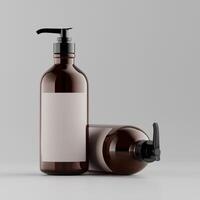 two amber pump bottles one lying down white label black caps neutral background soft shadows clean design photo