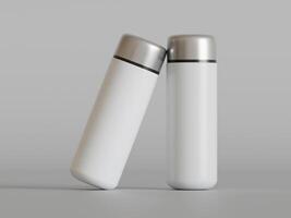two minimalist white insulated bottles leaning against each other on a plain grey background soft shadows photo