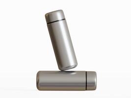 silver mini water bottle balanced on horizontal bottle clean white background soft shadows photo