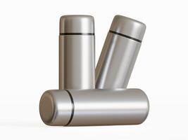 three stainless steel mini water bottles two standing one laying flat on white background photo