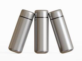 three stainless steel mini water bottles standing close with slight tilt on white background photo