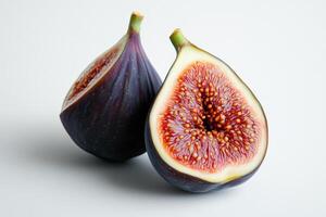 Two purple and red figs are cut in half photo