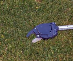 Pruning shears for high-altitude work. Close-up photo