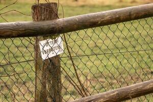 Do not feed animals sign on wooden fence protecting wildlife photo