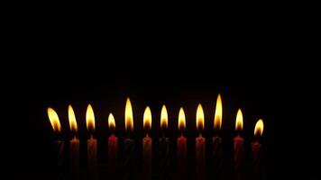 A serene and beautiful display of candles flickering gently in the dark, creating a truly calming atmosphere video