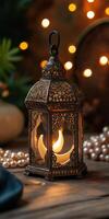 A lantern with candles on a wooden table photo