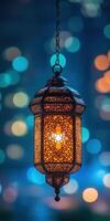 A decorative lamp hanging from a chain photo
