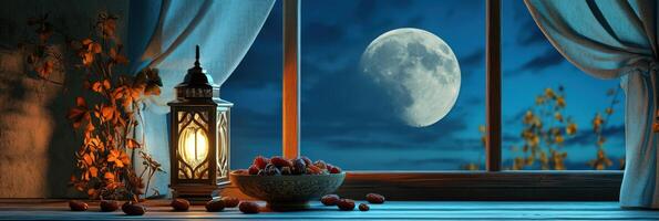 A window with a lantern and a bowl of fruit photo