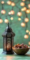 Ramadan kabob with dates and lantern on table photo