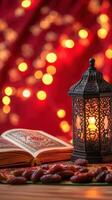 Ramadan kabah and quran with red lights on the table photo
