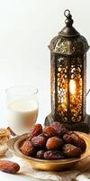 Dates and milk on a plate with a lantern photo