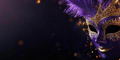 A purple and gold masquerade mask with gold feathers photo