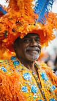 A man in an orange and blue costume with feathers photo