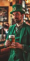 A man in a green suit holding a beer photo